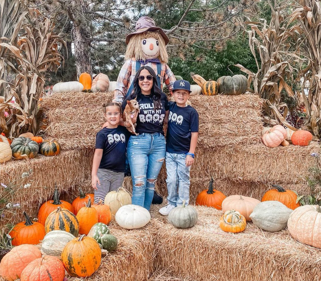 picture of matching family halloween shirts at a fall festival
