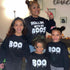 mom matching with 3 kids in halloween sweatshirt sets for halloween