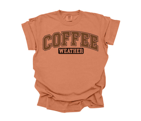 yam color t-shirt that is comfort colors with design that says coffee weather in crew neck shirt.