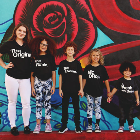 mother and children behind a grafitti art wall background in family matching shirts the original the remix, the encore, mic drop, a fresh new beat